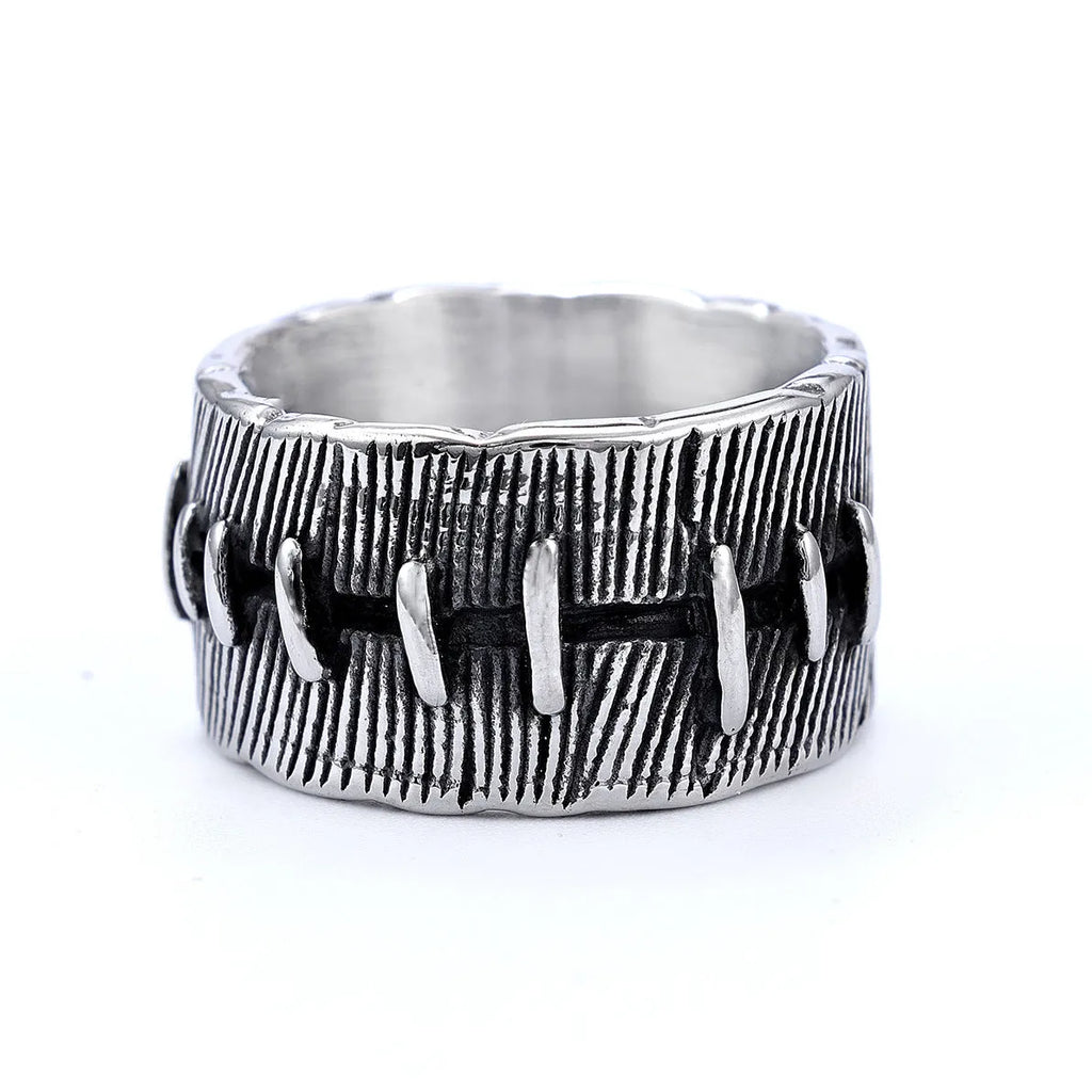 Titanium steel geometric U-shaped double ring with stitched texture in a retro colour.