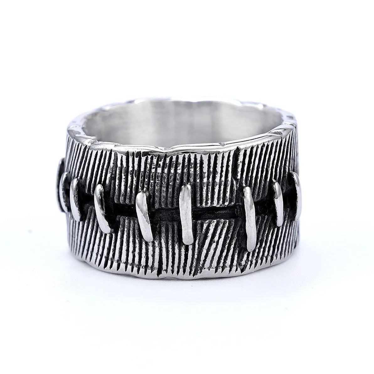 Titanium steel geometric U-shaped double ring with stitched texture in a retro colour.