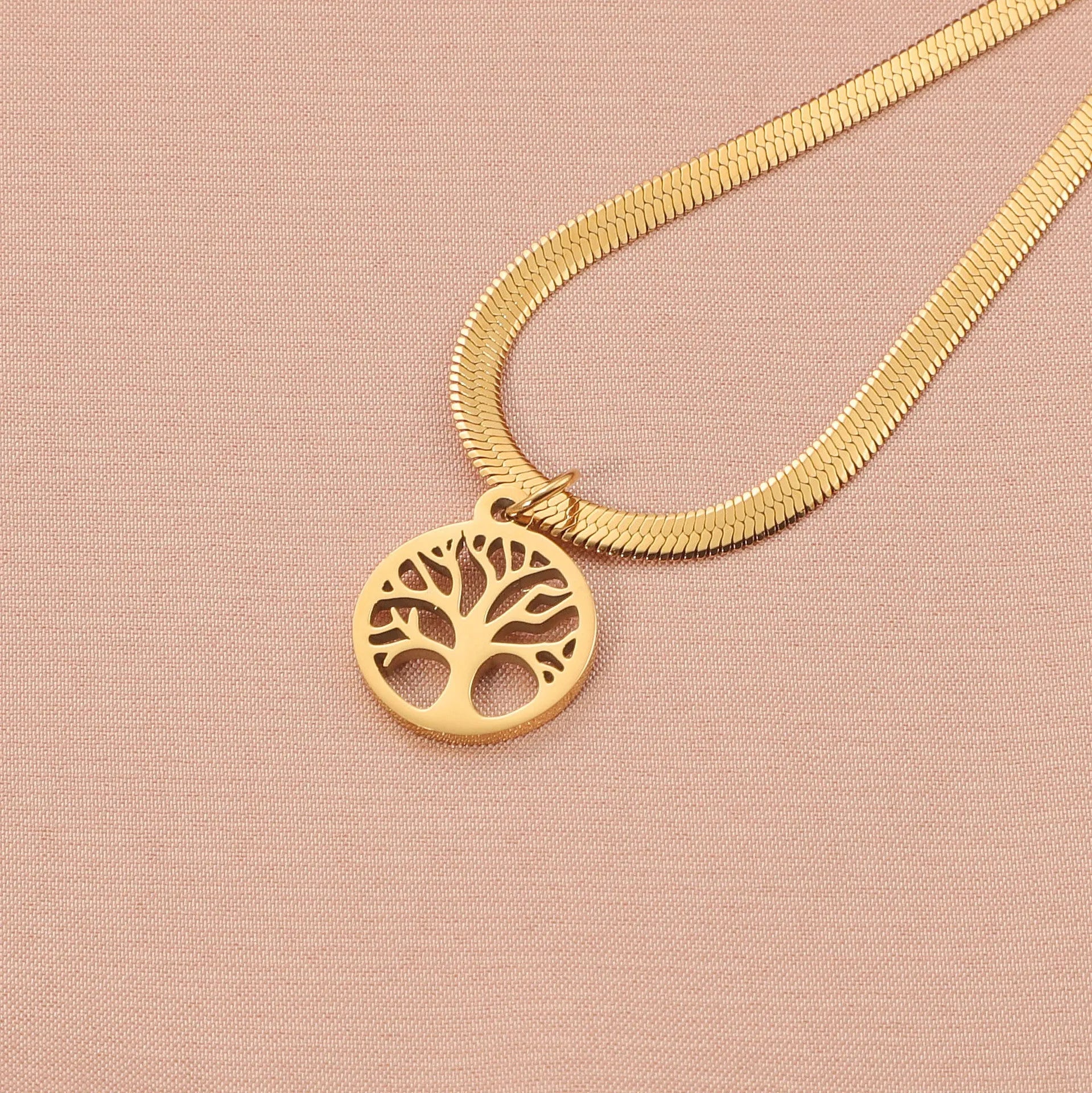 Stainless steel lucky tree necklace on a snake bone chain, showing gold and steel colour options.