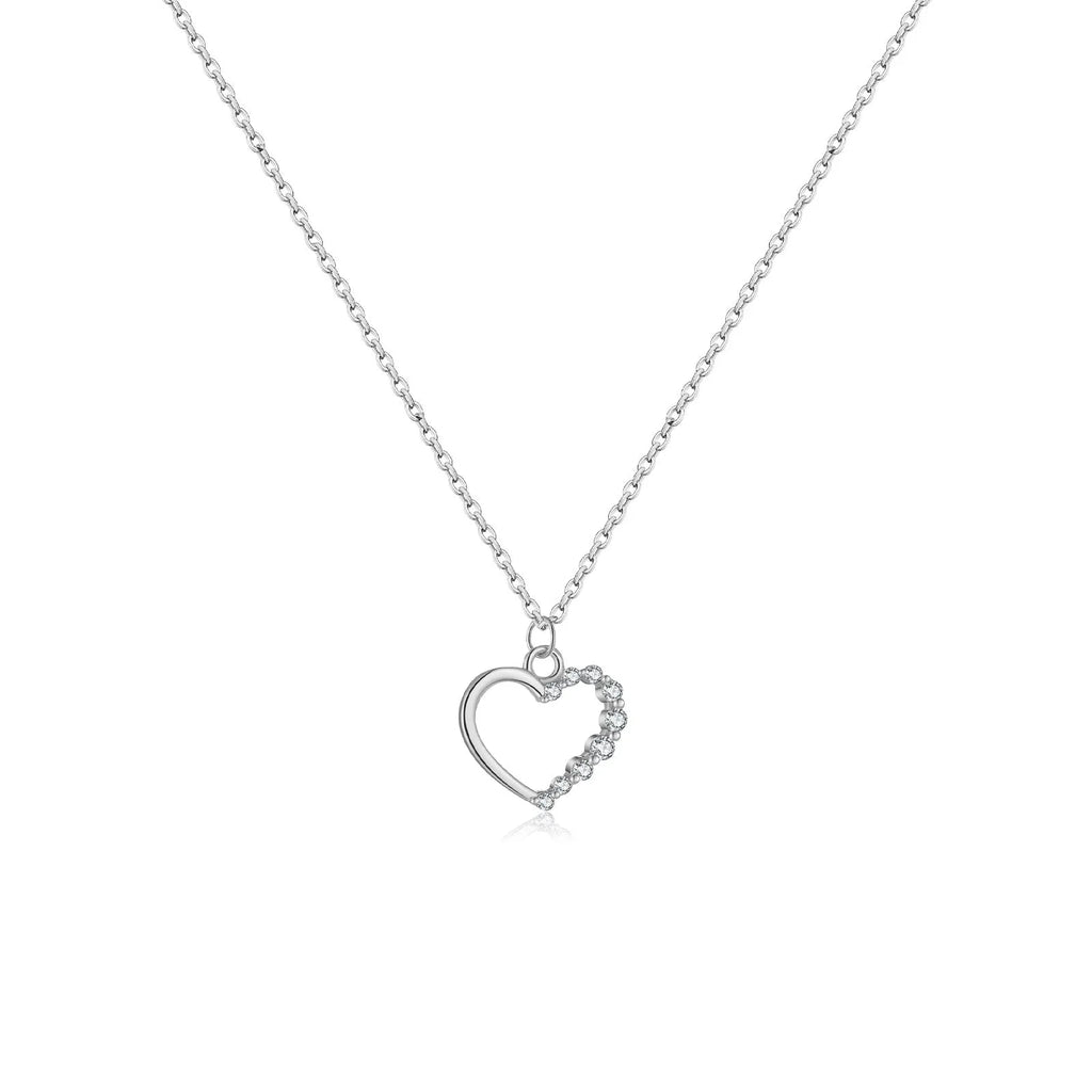 Sterling silver hollow heart pendant necklace on a regular chain, shown in a white gold colour finish.