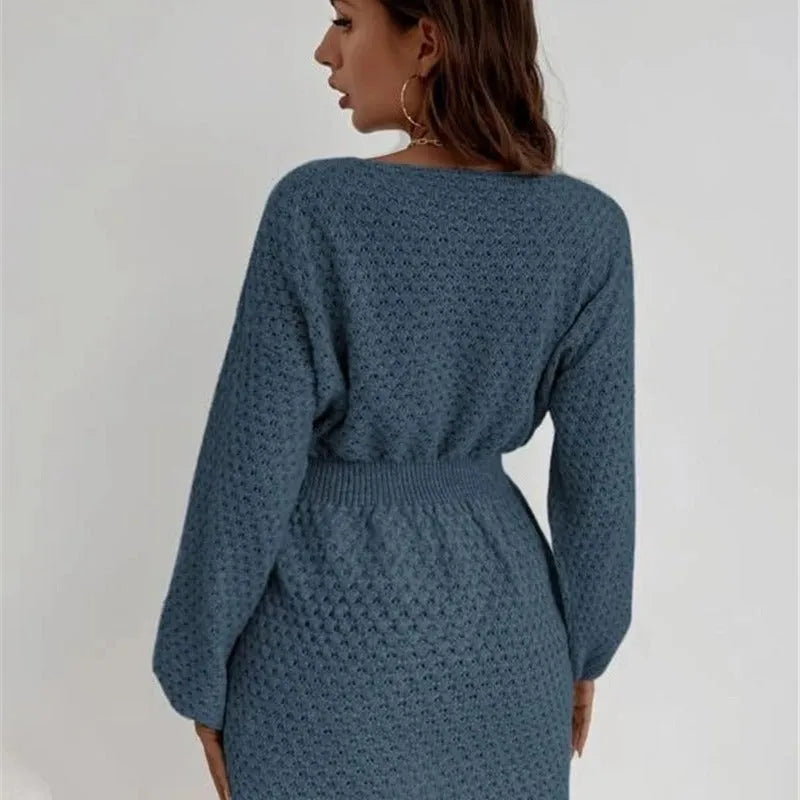 Blue women's knitted dress with crochet flower detail, round neck, and fitted waist
