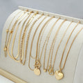 Gold electroplated women's necklace set with 10 alloy pendant pieces on snake bones chains
