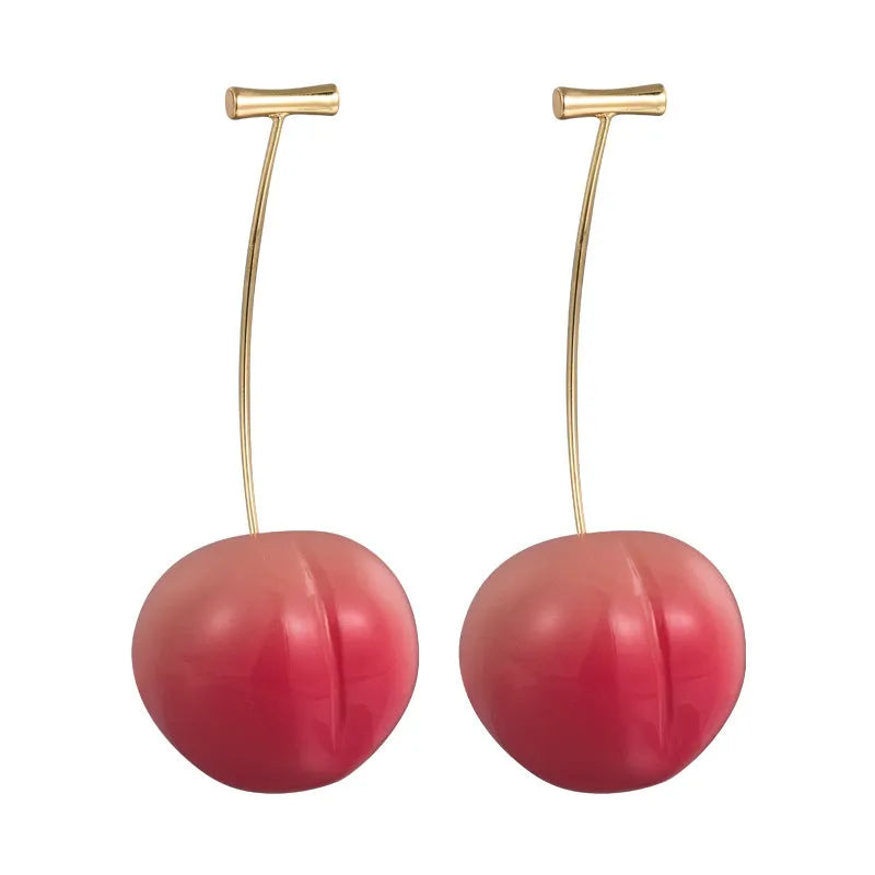 A pair of acrylic peach-shaped dangle earrings with copper hooks, shown in two size variants.