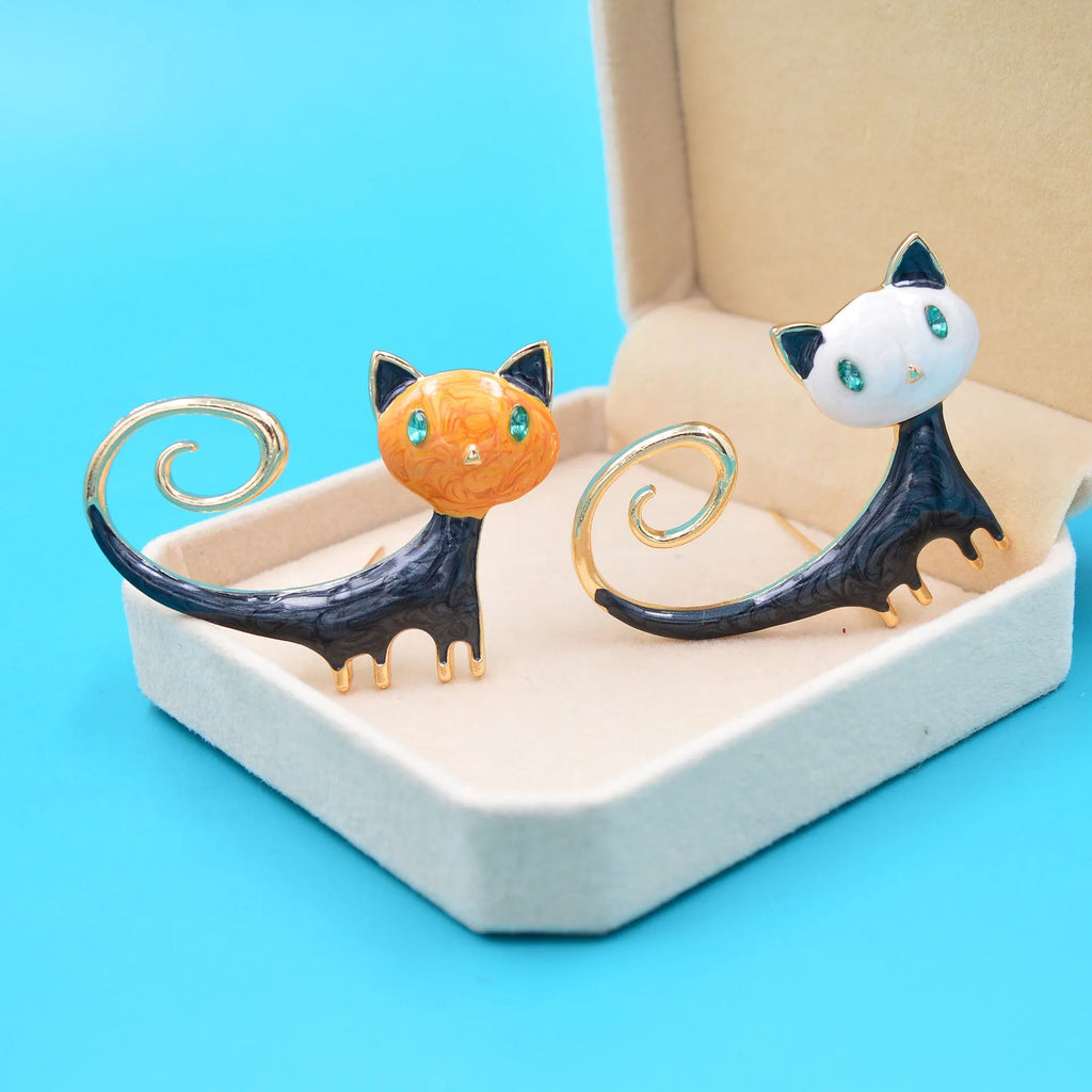 Personalised white and orange alloy cat brooch with painted tail detail.