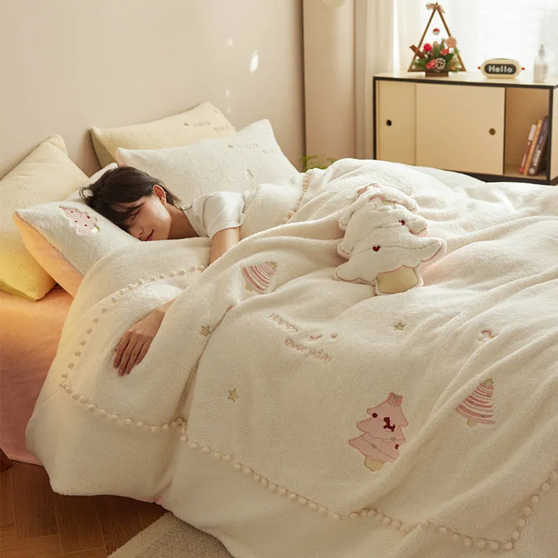 Winter milk fibre four-piece bedding set with green Christmas tree pattern on bed