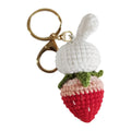Hand-woven white wire rabbit pendant with strawberry pattern and attached key chain