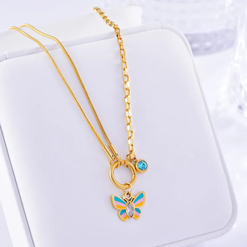 Gold titanium steel butterfly necklace and bracelet set with epoxy colourful detailing on snake bone chains