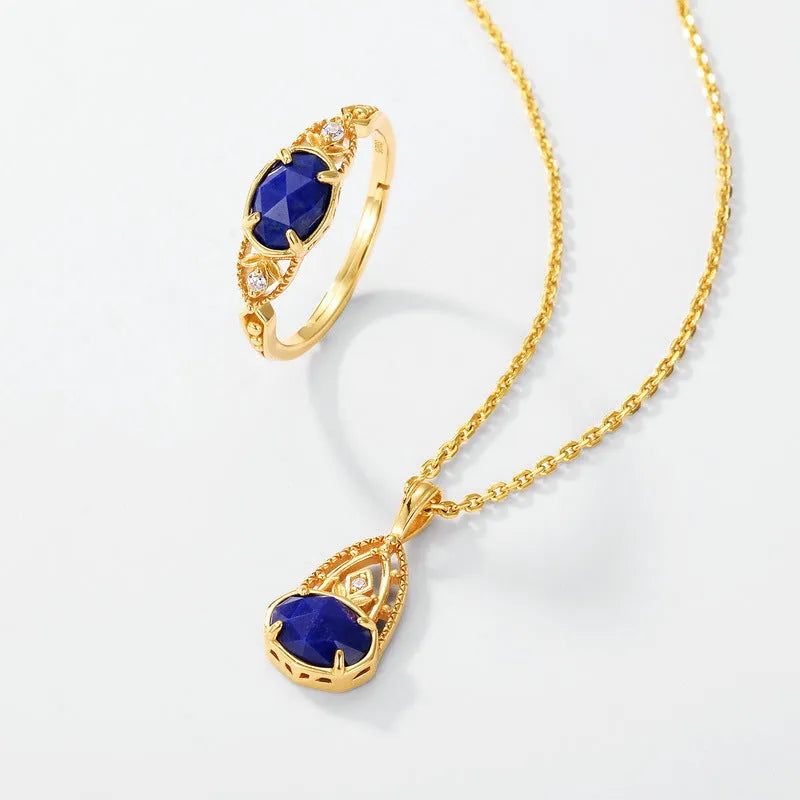 Japanese style silver alloy ring with elliptical geometric shape and blue lapis lazuli stone.