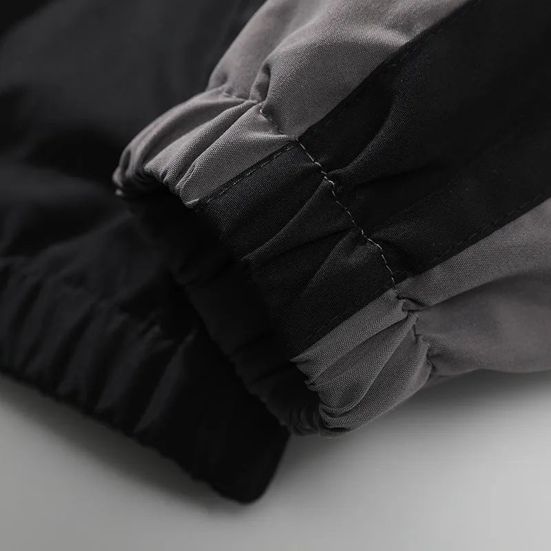 Men's loose fit casual jacket with contrast stitching and side pockets in black or dark blue.