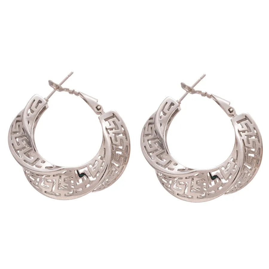 A pair of silver geometric women's stud earrings with a twisted round hollow design.
