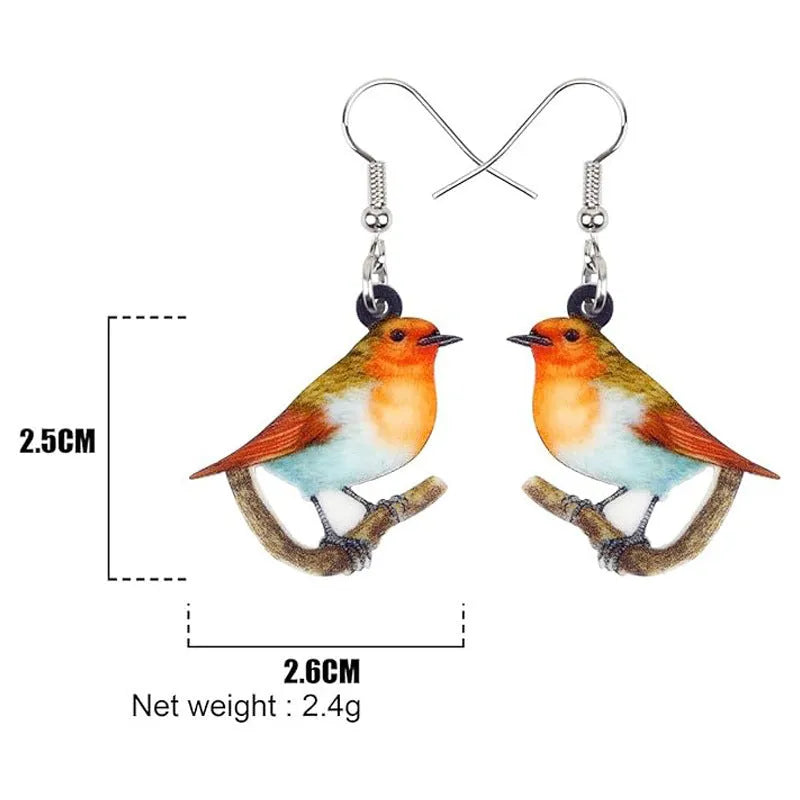 Close-up of women's acrylic earrings with a blue titmouse bird pendant and geometric snake motif design.
