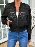 Black women's jacket with geometric pattern and semi-transparent polyester fabric showing zipper closure