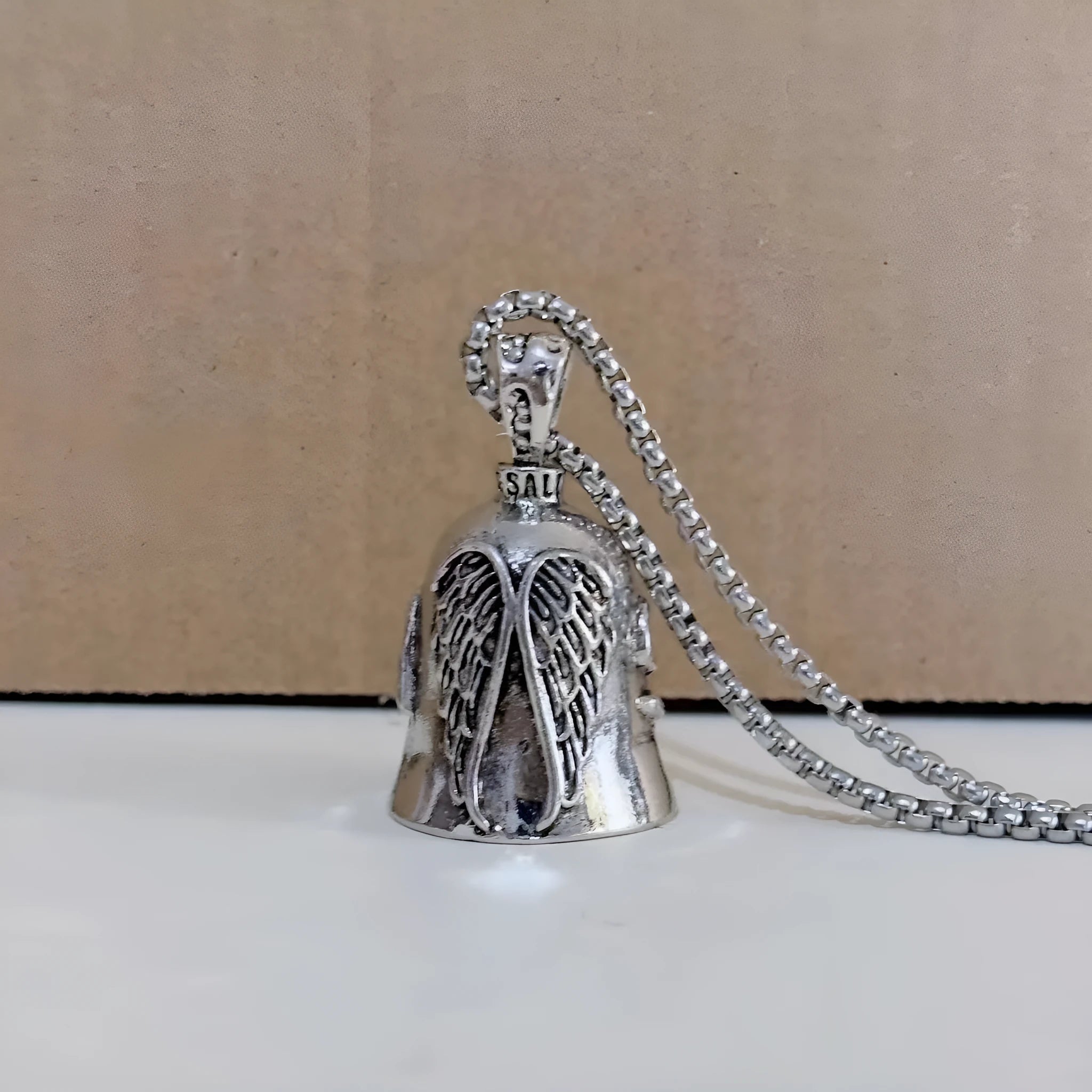 White vintage angel feather design on a zinc alloy necklace and matching keychain.