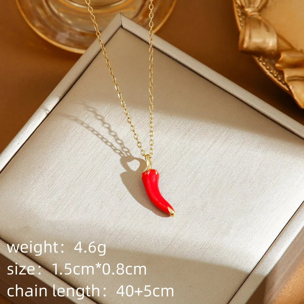 Women's titanium steel necklace with small red cherry, strawberry, and pepper charms on O-ring chain.