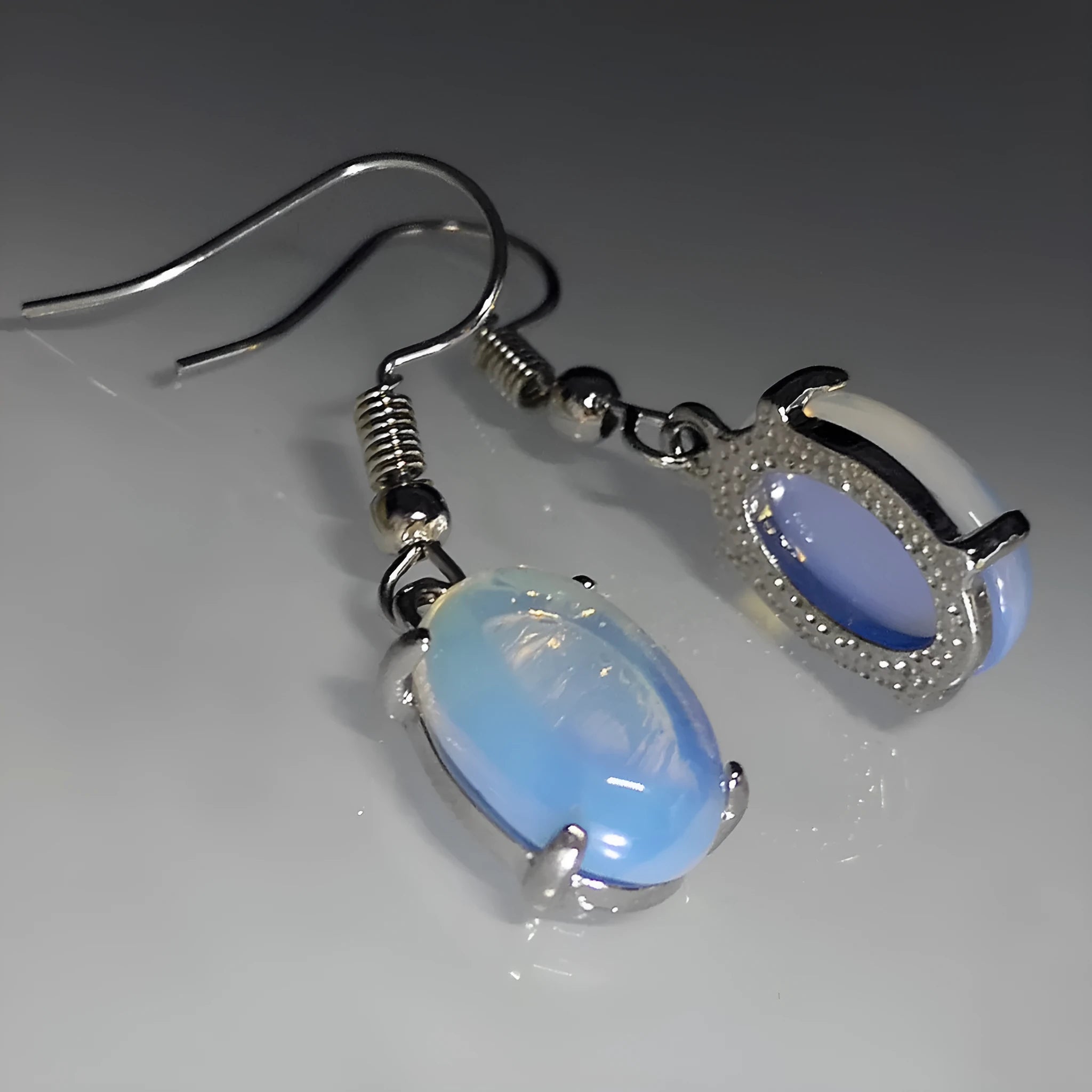 Retro moonstone opal cross drop earrings in electroplated alloy with moonlight white colour