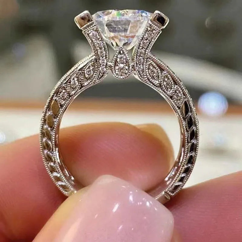 Electroplated alloy women's geometric engagement ring in gold or white colour on size display