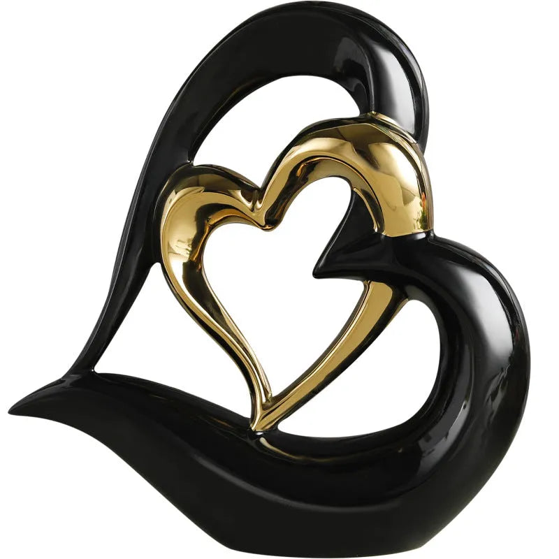 Modern white porcelain heart-shaped geometric ornament in a metallic gold finish.