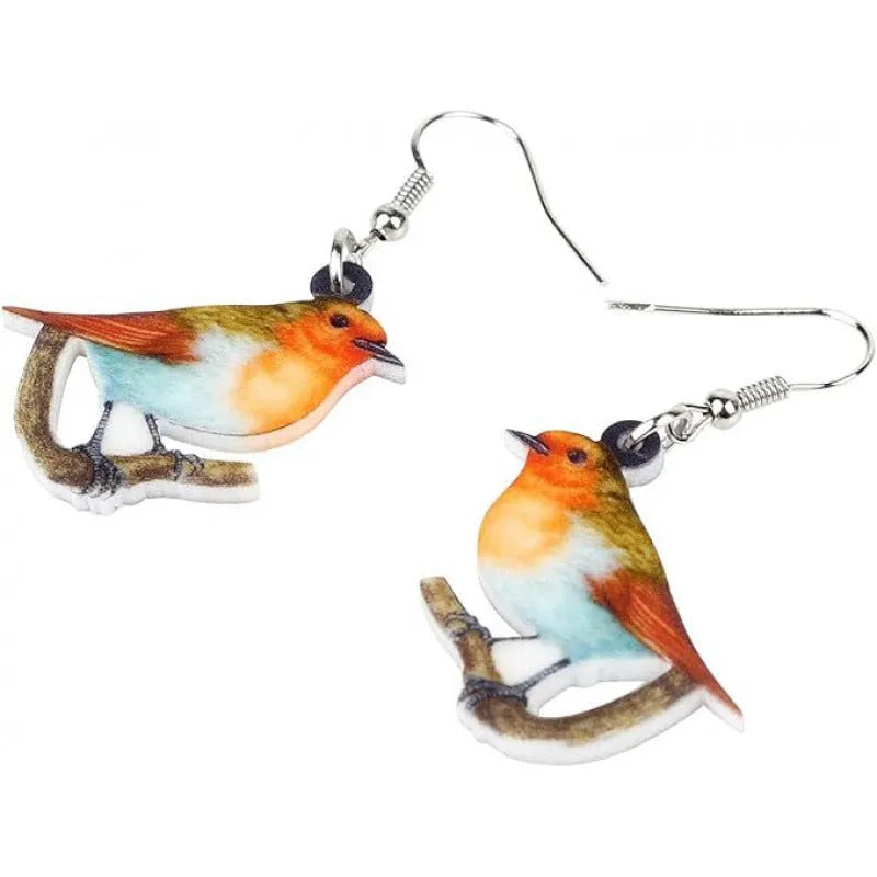 Close-up of women's acrylic earrings with a blue titmouse bird pendant and geometric snake motif design.
