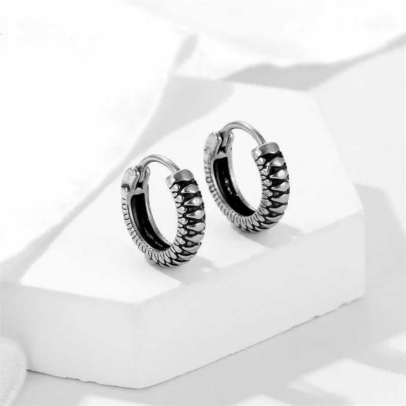 Silver geometric stripe earrings with retro twist design and sports style aesthetic