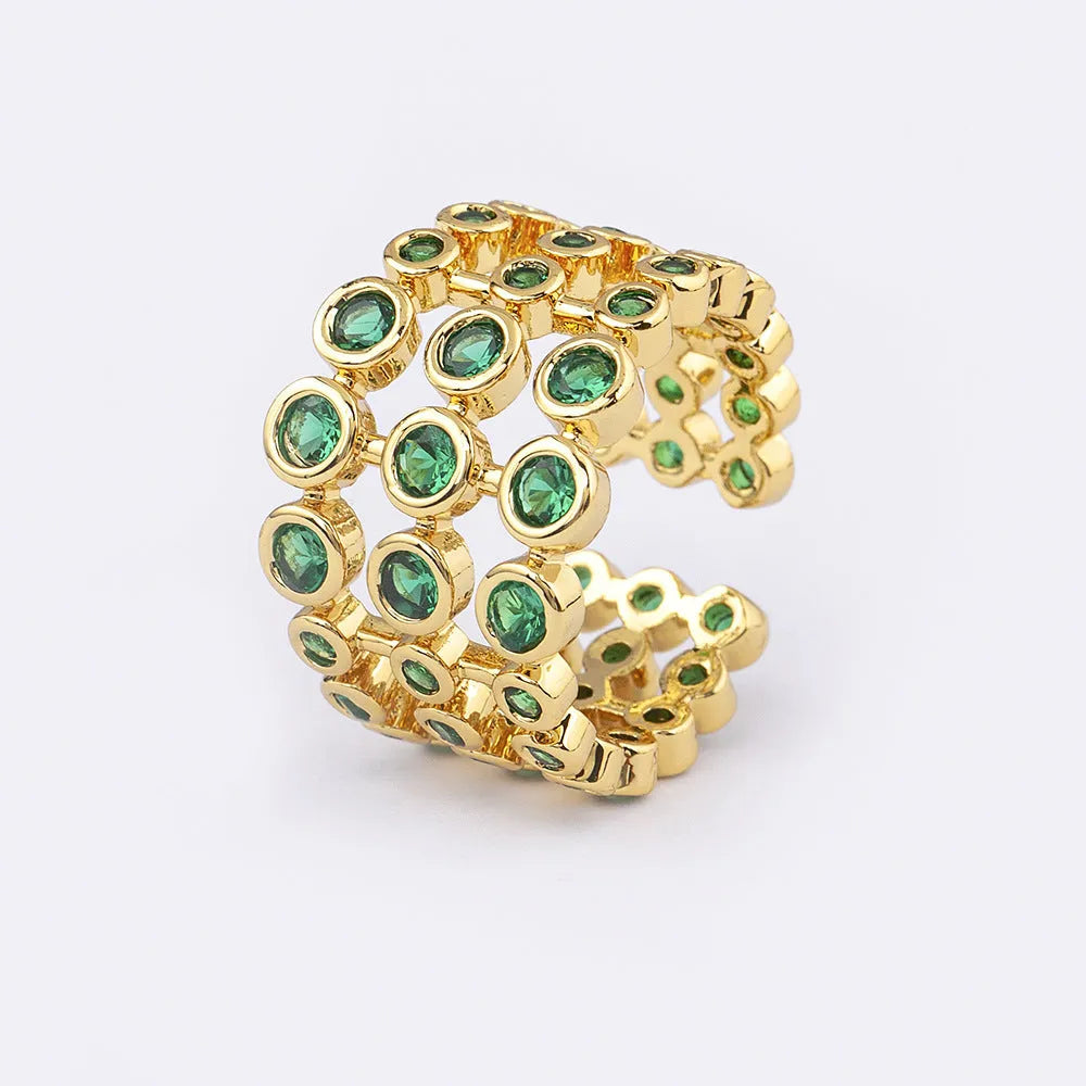 Wide gold-plated copper ring with a large cluster of green zircon stones.