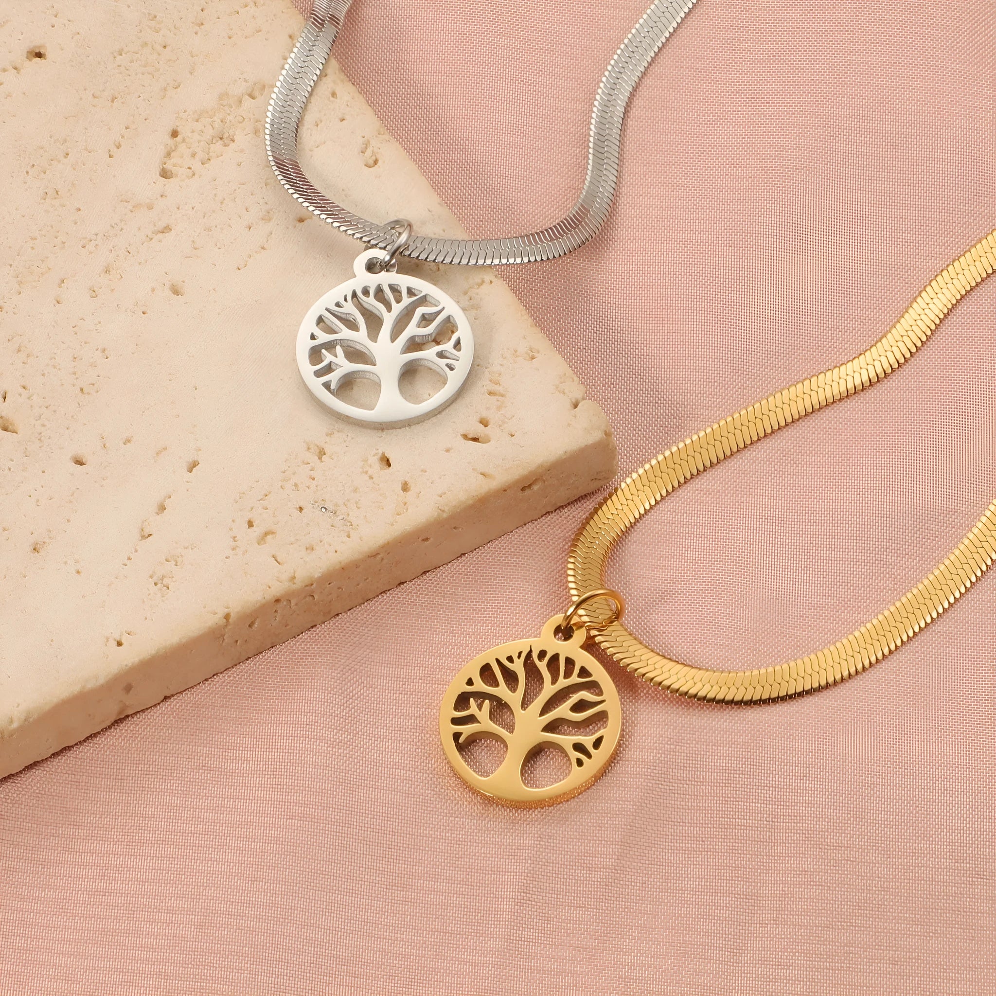 Stainless steel lucky tree necklace on a snake bone chain, showing gold and steel colour options.