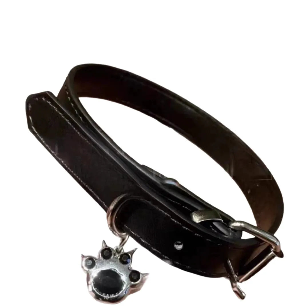 Black adjustable dog collar showing LD leather, bone, and cat paw design options.
