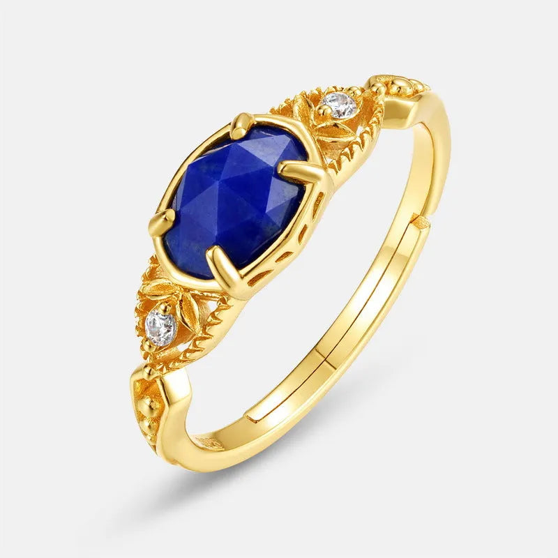 Japanese style silver alloy ring with elliptical geometric shape and blue lapis lazuli stone.