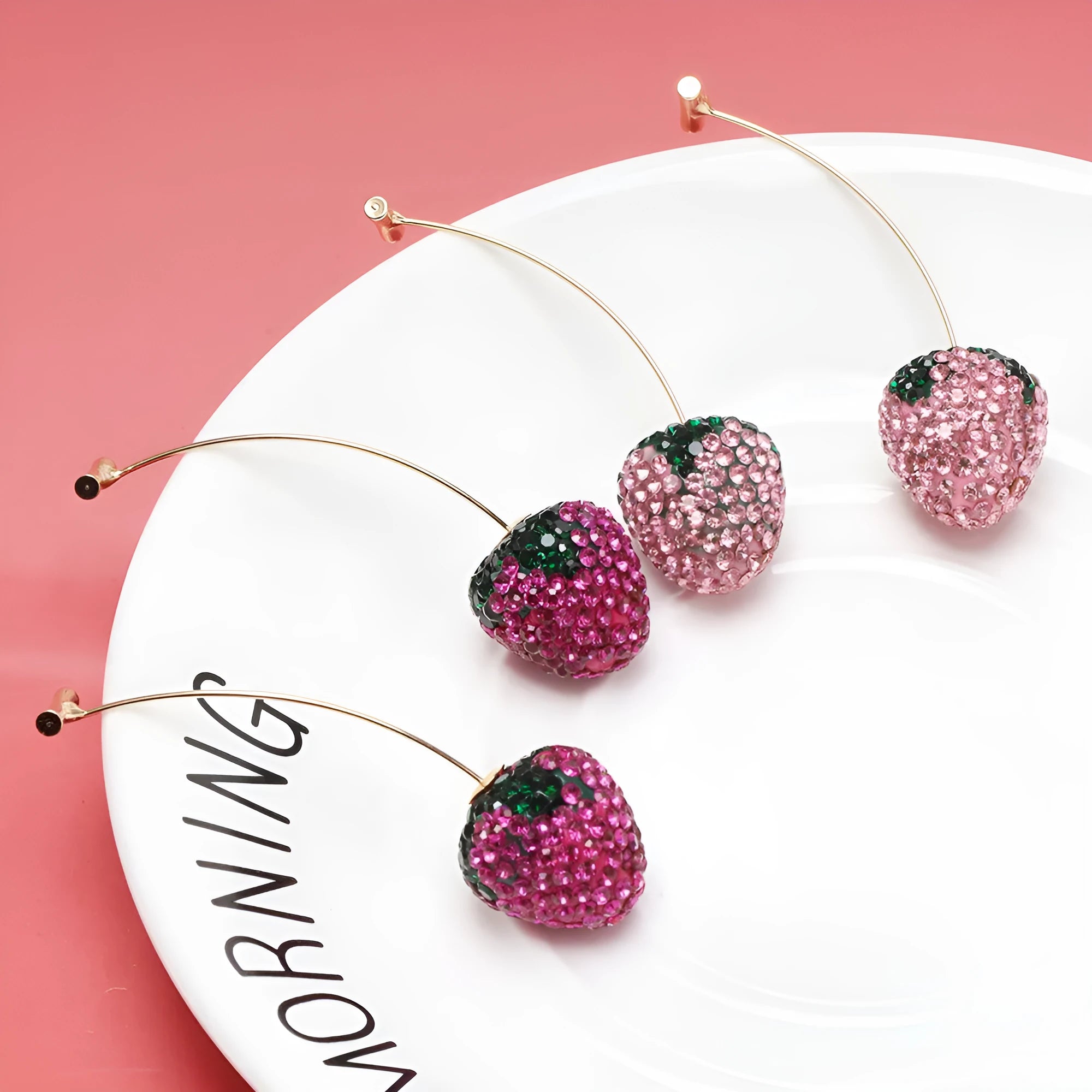 Red geometric strawberry stud earrings made from zinc alloy for women.
