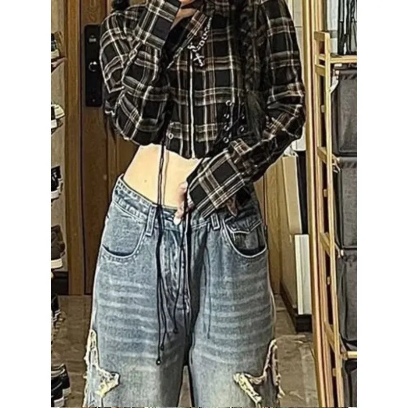 Blue women's high waist straight leg jeans laid flat, showing the classic five-pocket design and straight cut.