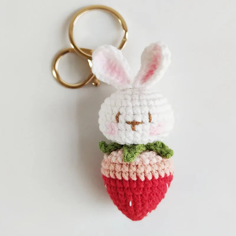Hand-woven white wire rabbit pendant with strawberry pattern and attached key chain