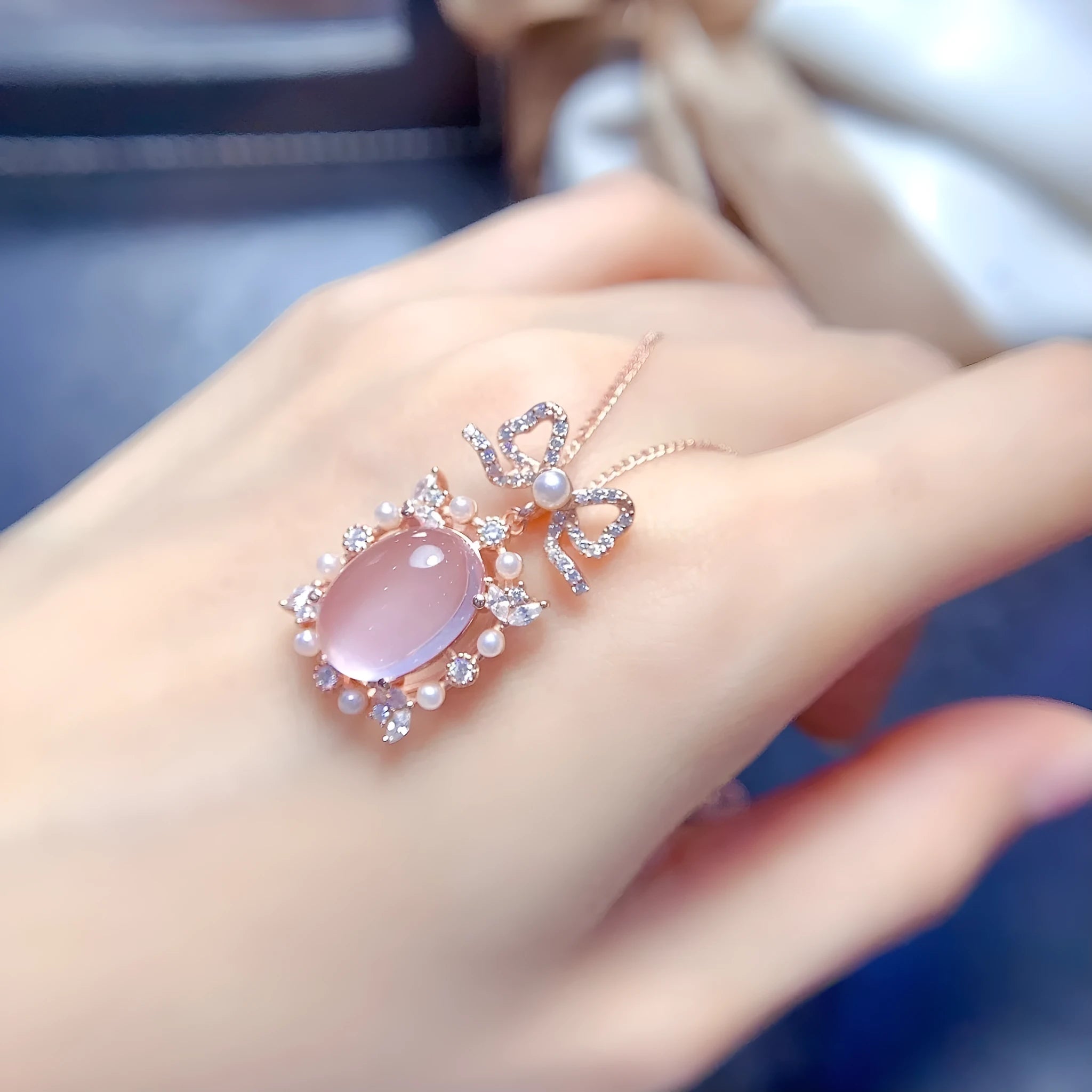 Geometric silver pendant with rose quartz stone and rose gold plating on an alloy chain