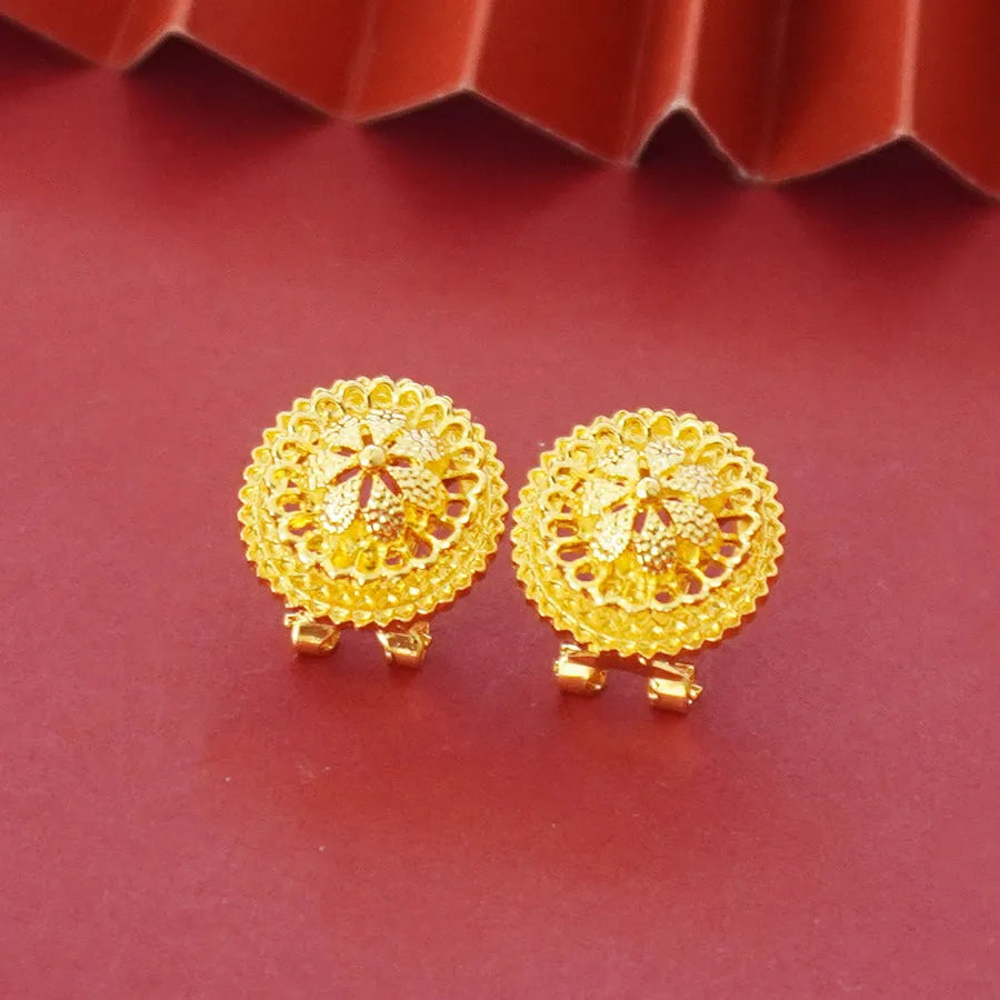 Gold-plated three-piece jewellery set showing necklace with floral pendant, matching earrings, and ring on a water wave chain.