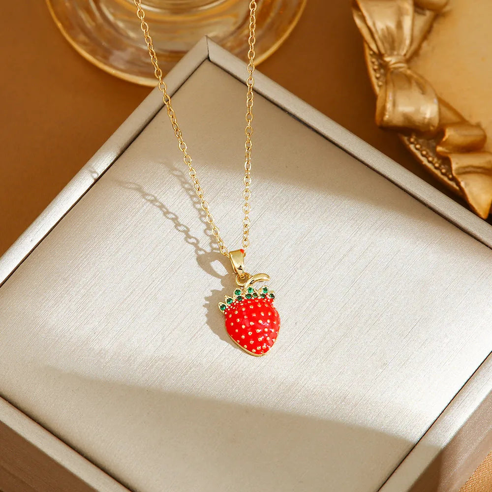 Women's titanium steel necklace with small red cherry, strawberry, and pepper charms on O-ring chain.