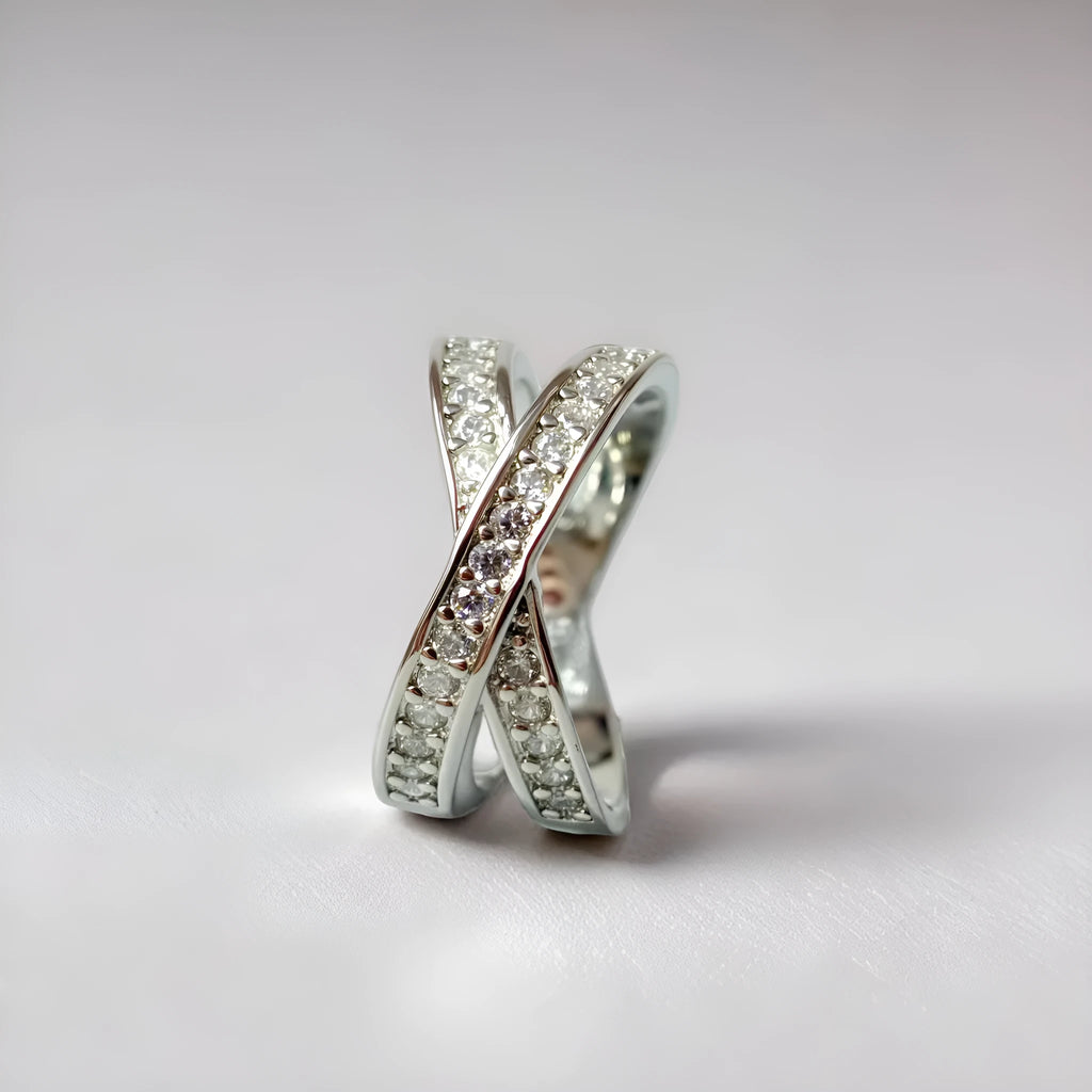 Silver cross ring with micro-inlaid zircon stones and geometric heart design on hand