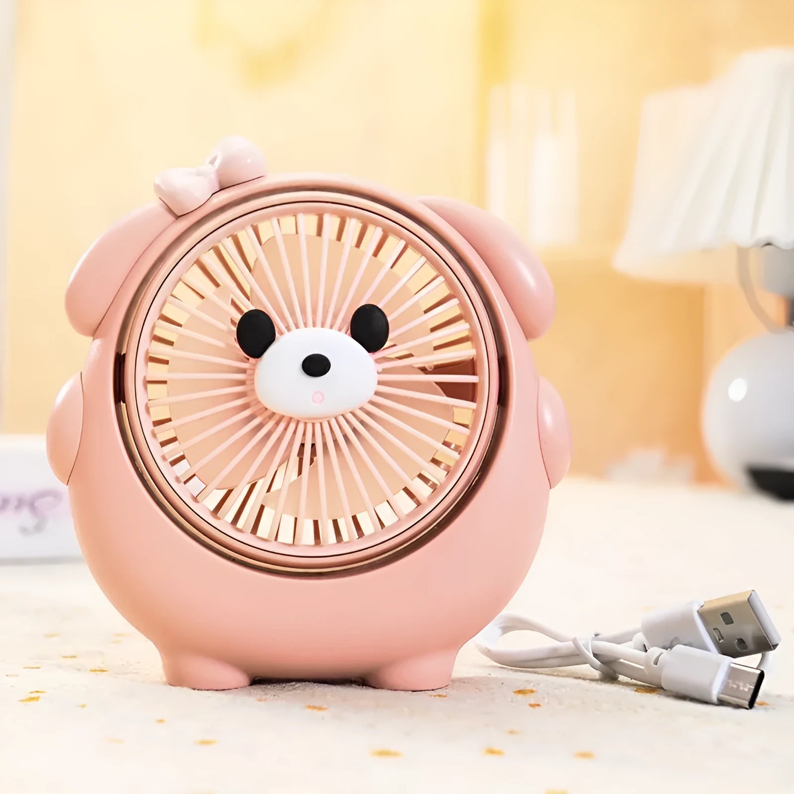 USB desk fan with bear and puppy design showing brown, apricot, and pink colour options.