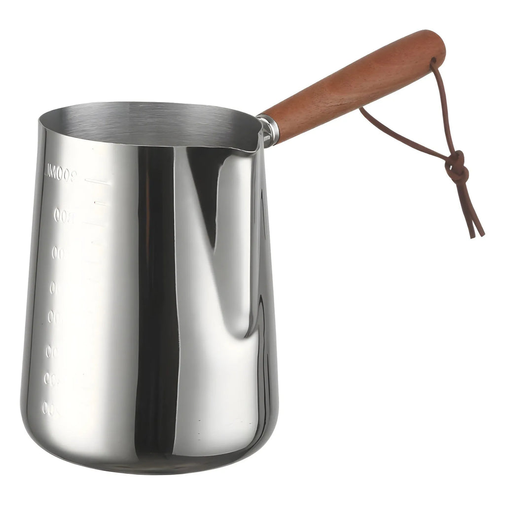 Stainless steel coffee cup with wooden handle showing interior measurement scale for latte art