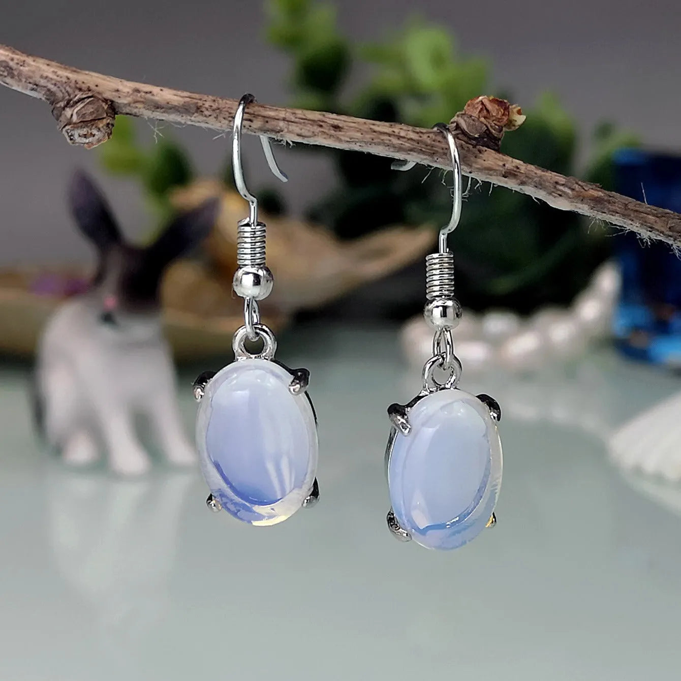 Retro moonstone opal cross drop earrings in electroplated alloy with moonlight white colour