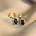 A pair of black geometric quadrilateral copper earrings with a French court retro design.