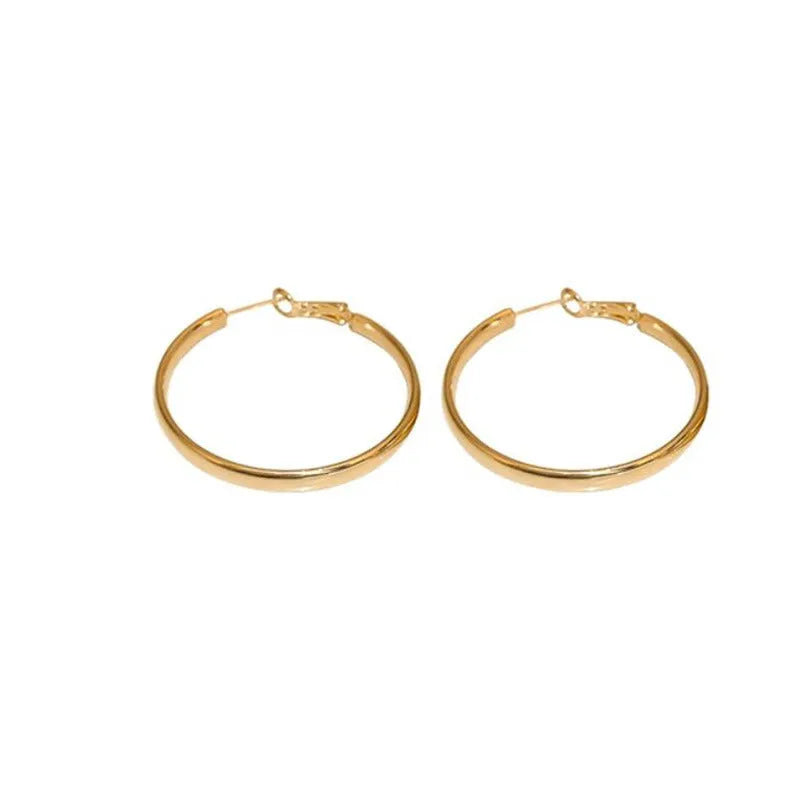 A pair of round gold-coloured metal hoop earrings on a 40mm diameter circle.