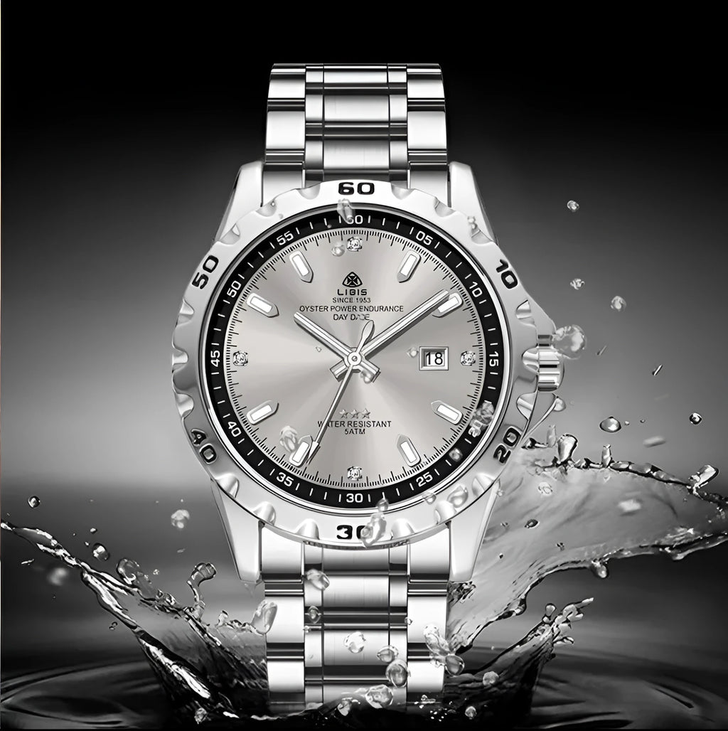Silver case men's quartz watch with luminous hands and stainless steel bracelet on wrist
