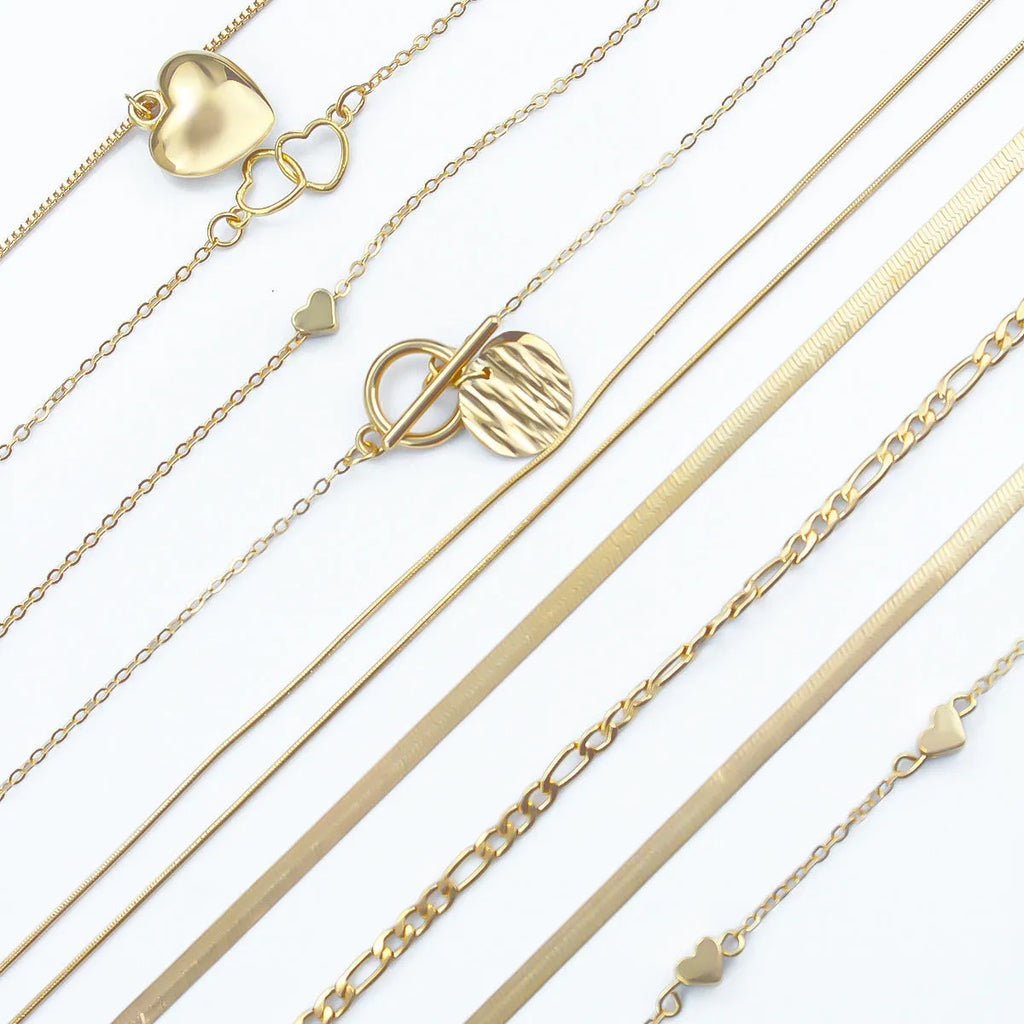 Gold electroplated women's necklace set with 10 alloy pendant pieces on snake bones chains
