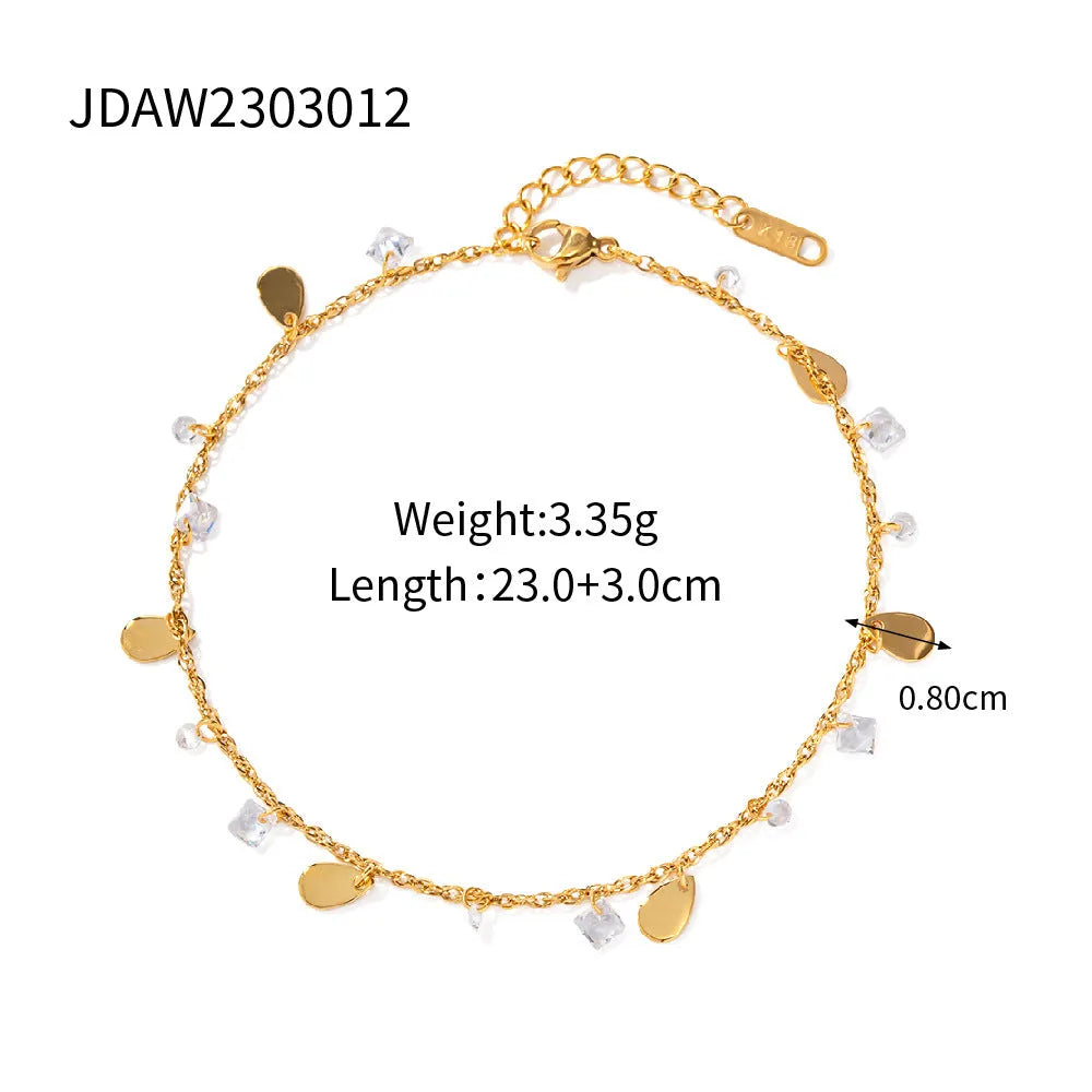 Stainless steel women's anklet with a water drop tassel charm and geometric details.