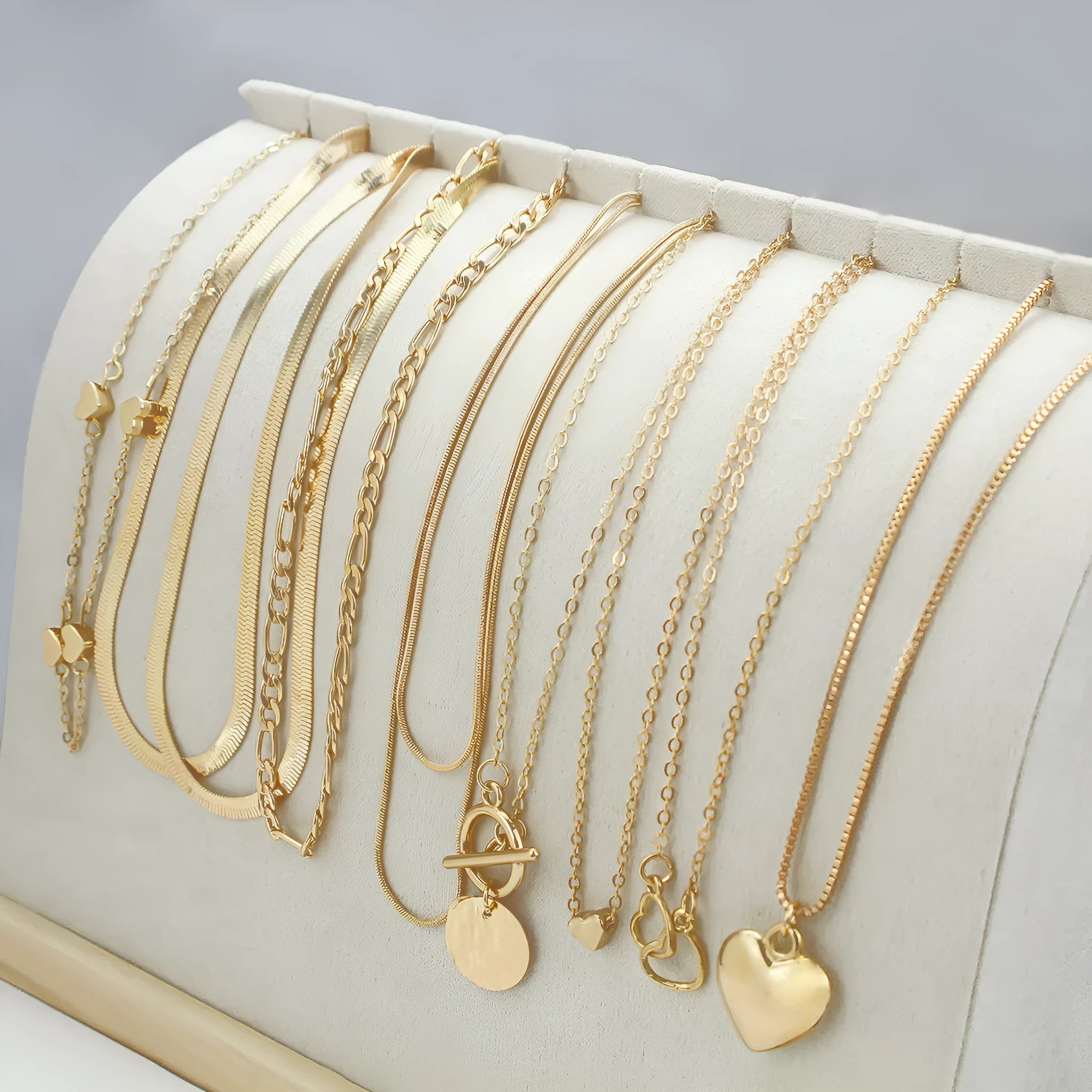 Gold electroplated women's necklace set with 10 alloy pendant pieces on snake bones chains