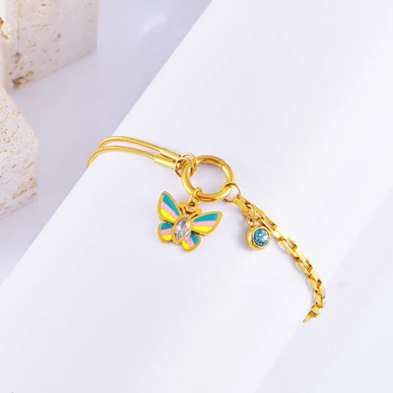 Gold titanium steel butterfly necklace and bracelet set with epoxy colourful detailing on snake bone chains