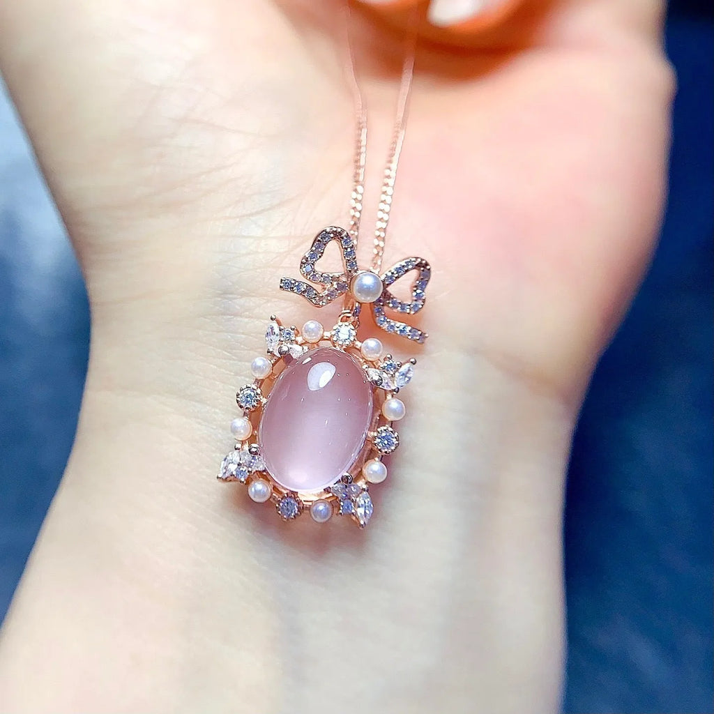 Geometric silver pendant with rose quartz stone and rose gold plating on an alloy chain