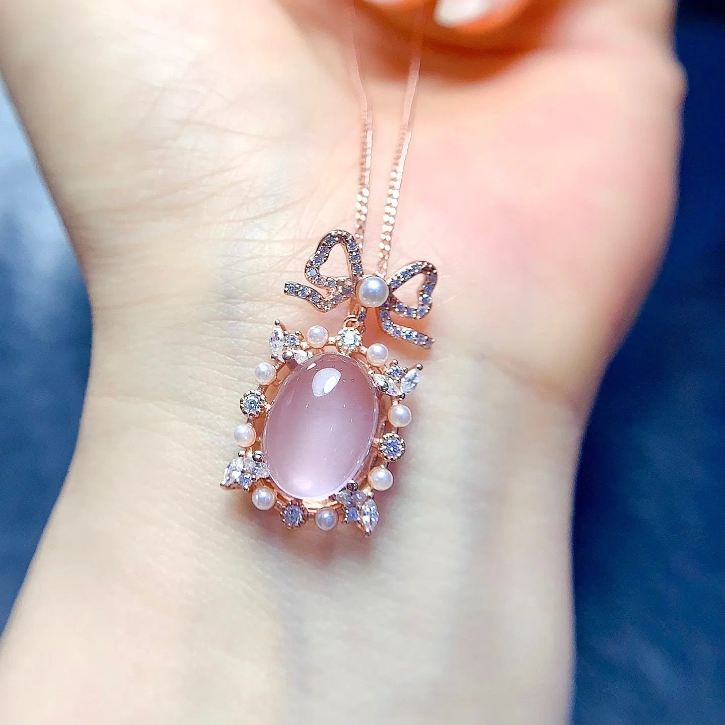Geometric silver pendant with rose quartz stone and rose gold plating on an alloy chain