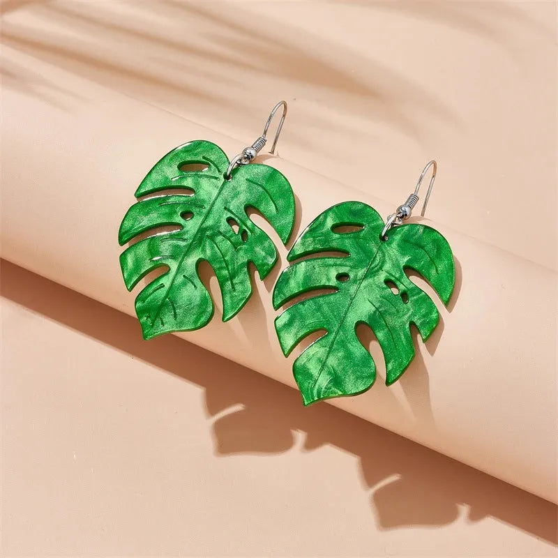 Close-up of acrylic drop earrings with a coconut artocarpus design on alloy hooks, showing one of five colour styles.