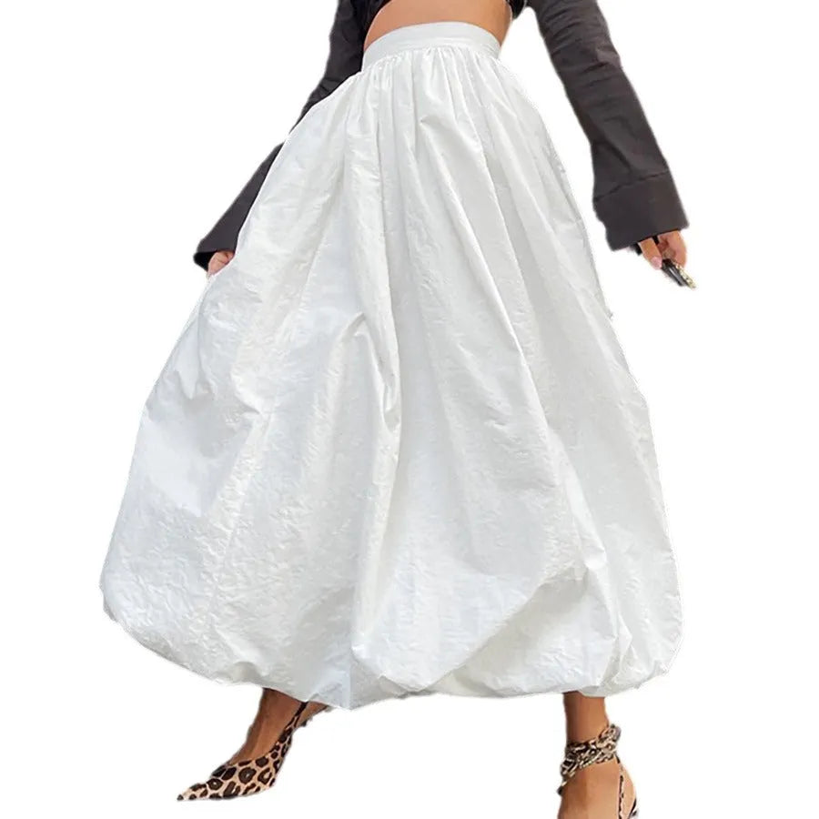 Women's long solid colour cotton skirt in black on a hanger.