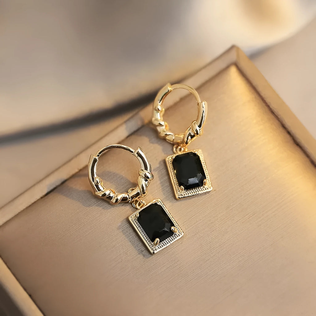 A pair of black geometric quadrilateral copper earrings with a French court retro design.