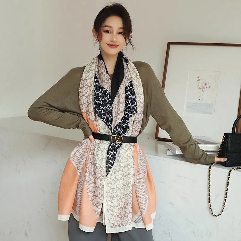 Women's printed polyester scarf showing decorative pattern and mid-length dimensions for autumn wear